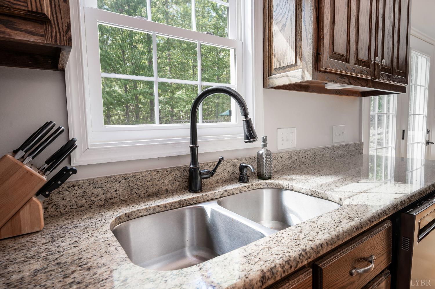 333 Sunset Ridge Drive Concord, VA 24538 - Photo 25 of 61 a kitchen with granite countertop a sink and a window