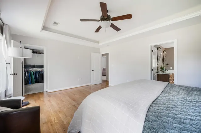 a bath tub sitting in a bathroom next to a window