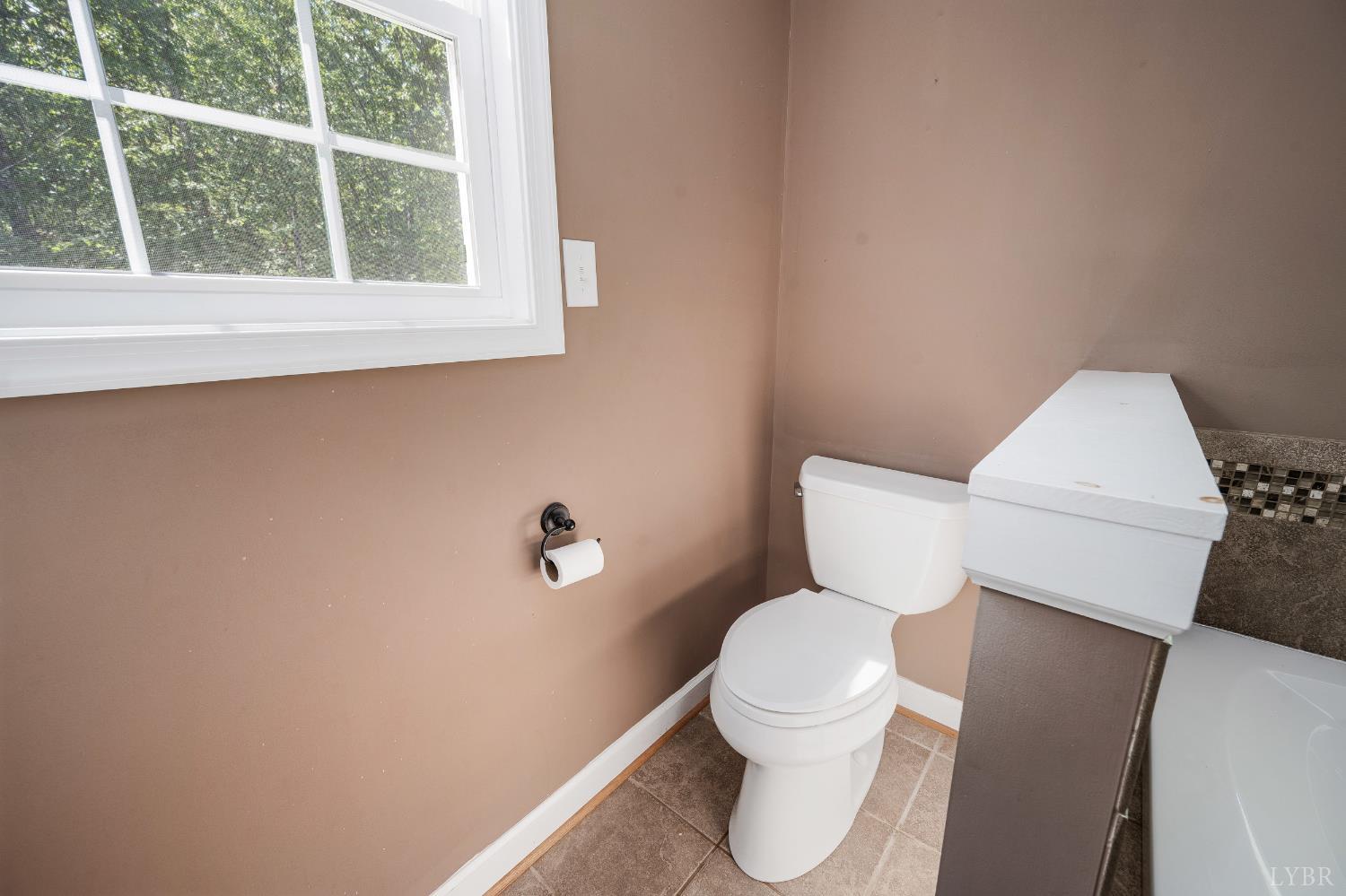 333 Sunset Ridge Drive Concord, VA 24538 - Photo 37 of 61 a white toilet sitting next to a window