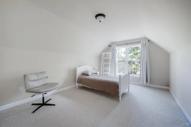a view of a workspace with furniture and wooden floor