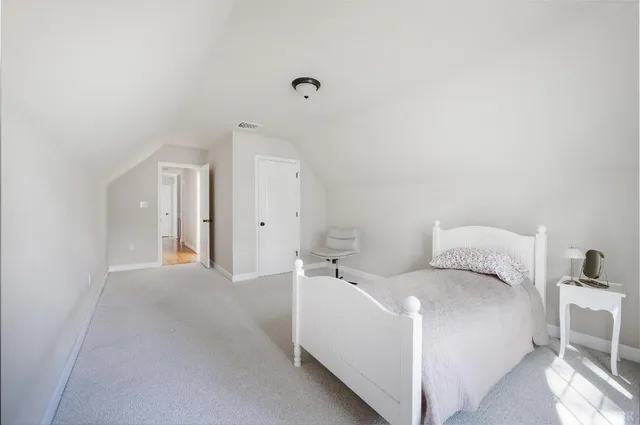a bathroom with a toilet sink and shower