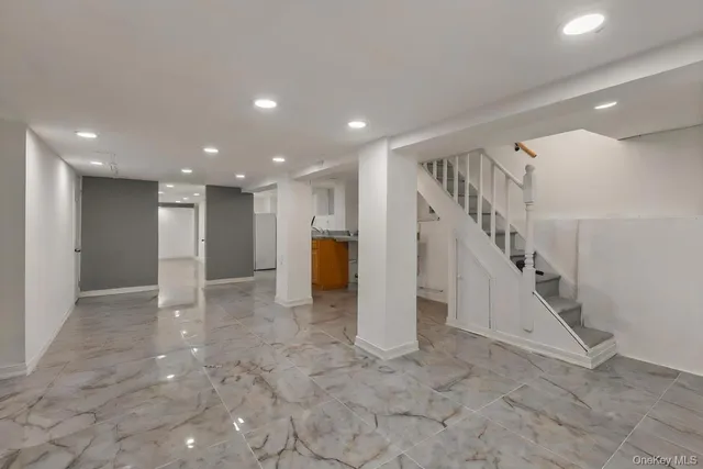 a view of an empty room with stairs