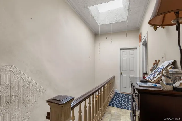 a view of a hallway with stairs