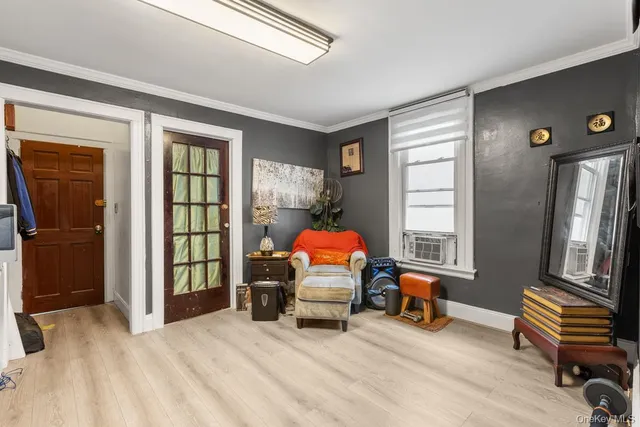 a bedroom with furniture and a window