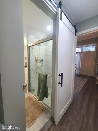 a view of a hallway with a room