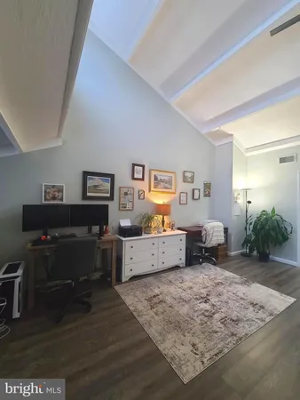 a room with furniture and wooden floor