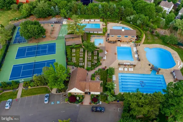 an aerial view of a house with a garden and plants