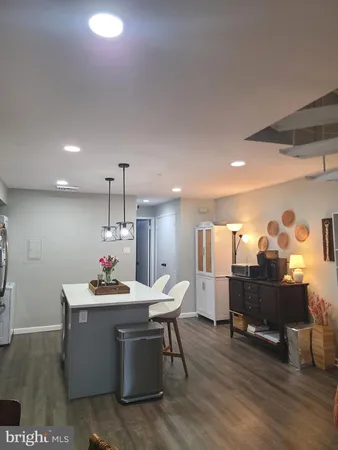 a room with wooden floor and furniture