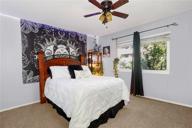 a bedroom with bed and window