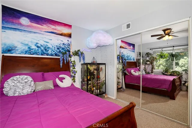 a bathroom with a sink a toilet and a shower curtain