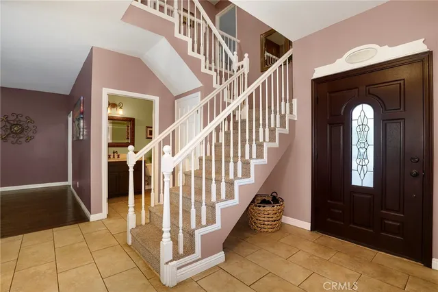 a view of entryway and hall with a front door
