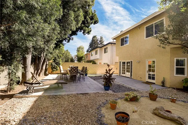 a view of a yard with trees in the background