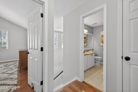 a bedroom with two beds and a flat screen tv