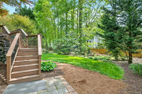 a view of a swimming pool with a yard