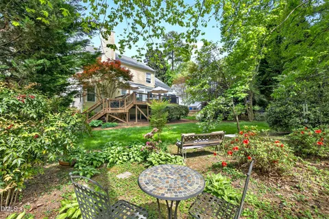 an aerial view of a house with a yard and balcony