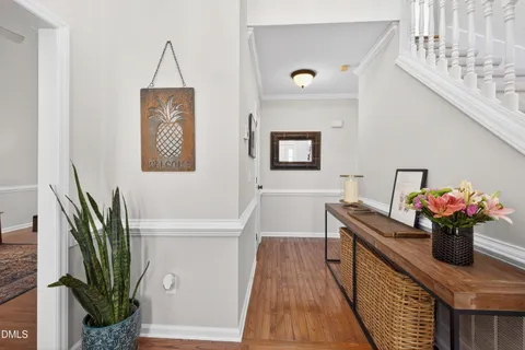 a kitchen with granite countertop white cabinets and stainless steel appliances