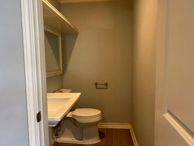 a bathroom with a toilet and a sink