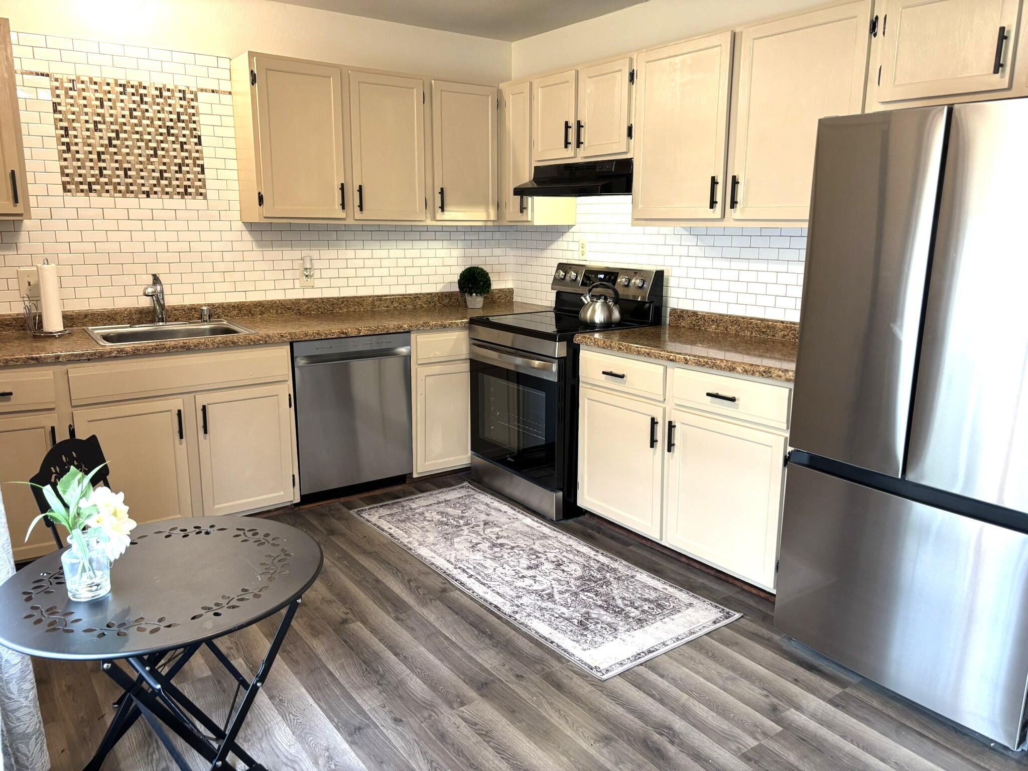 6081 West Calumet Road Milwaukee, WI 53223 - Photo 12 of 29 Luxury Vinyl Flooring