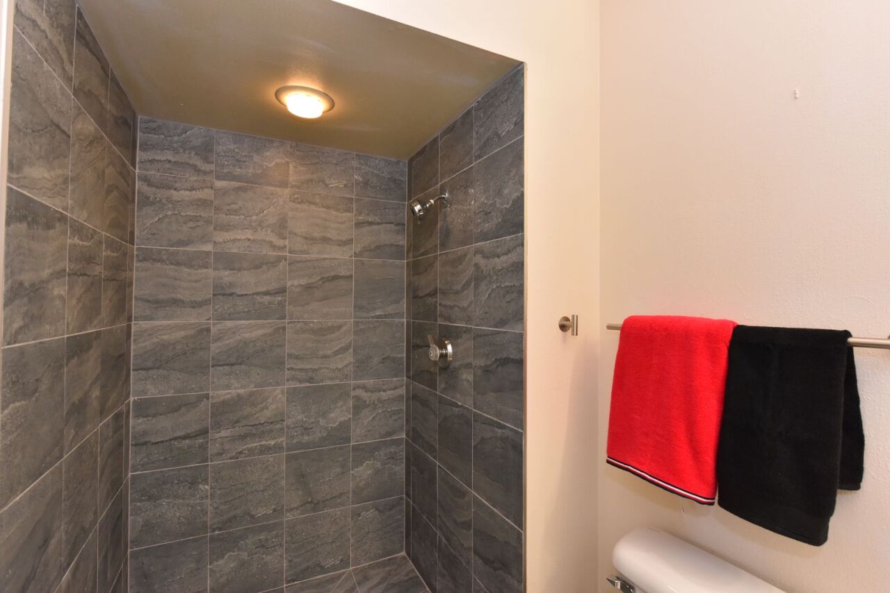 6081 West Calumet Road Milwaukee, WI 53223 - Photo 18 of 29 Shower with Custom Tilework