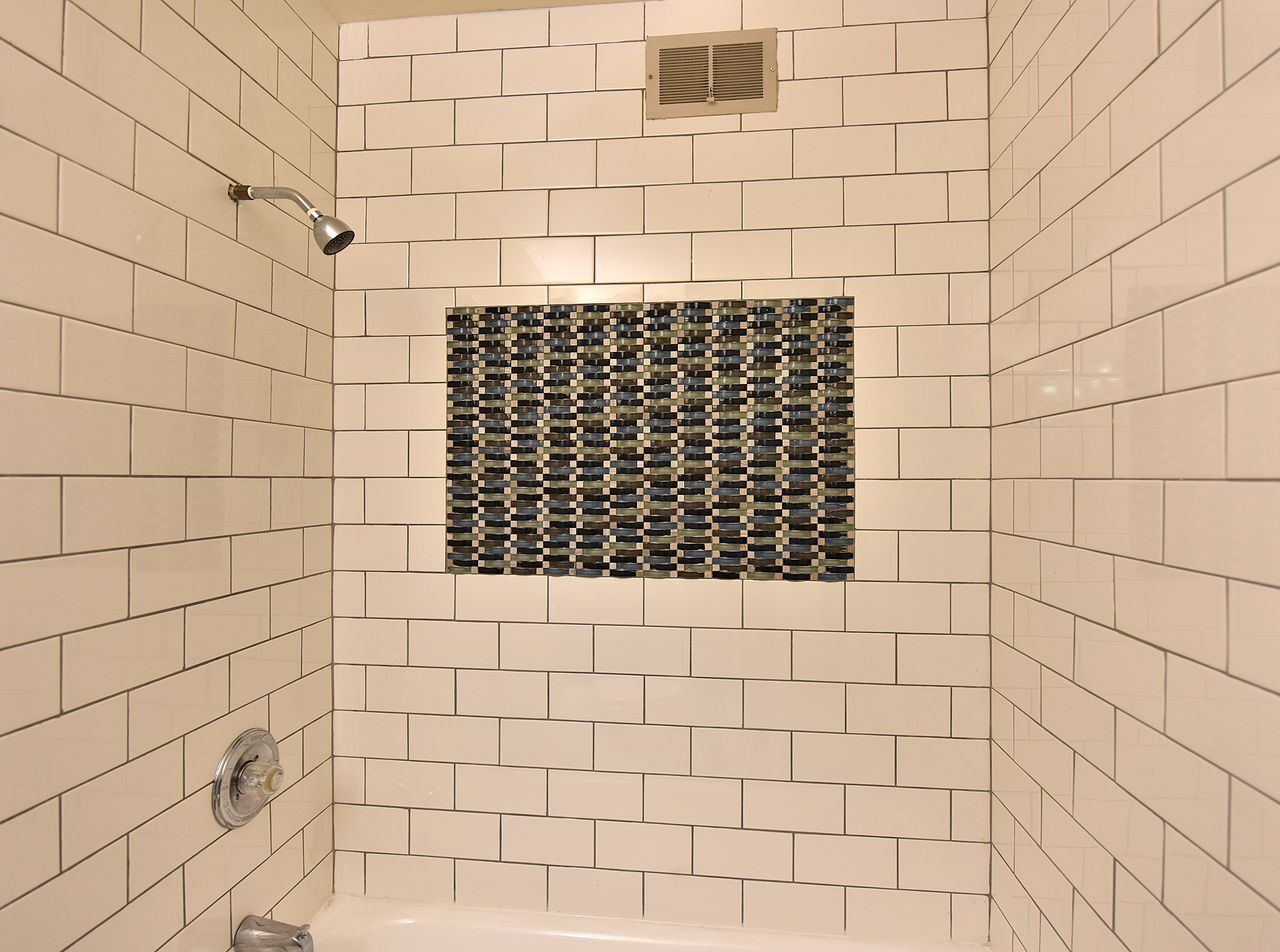 6081 West Calumet Road Milwaukee, WI 53223 - Photo 23 of 29 Mosaic Tile Design Over Tub