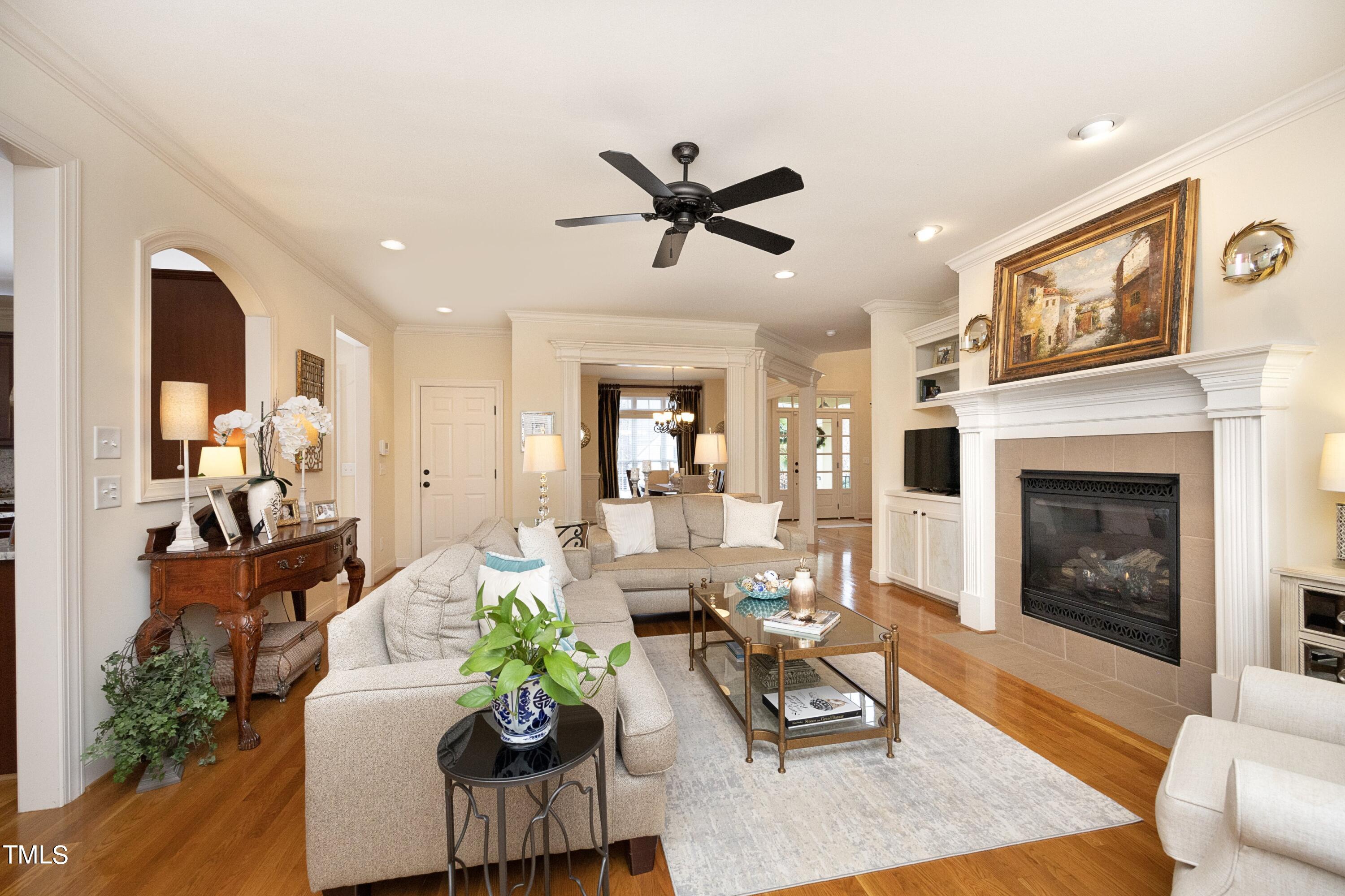 11514 Autumn Oaks Lane Raleigh, NC 27614 - Photo 12 of 39 a living room with furniture fireplace and wooden floor