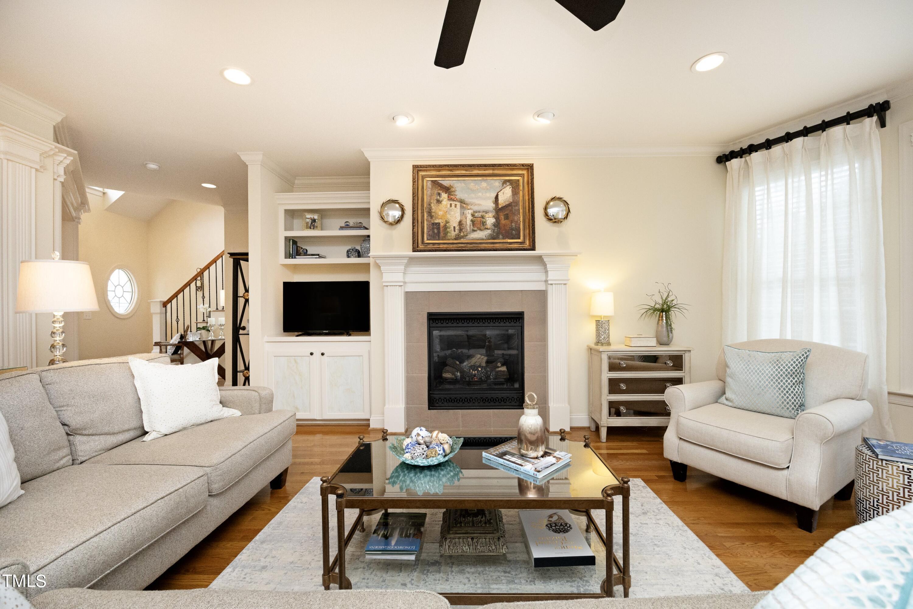 11514 Autumn Oaks Lane Raleigh, NC 27614 - Photo 13 of 39 a living room with furniture and a fireplace