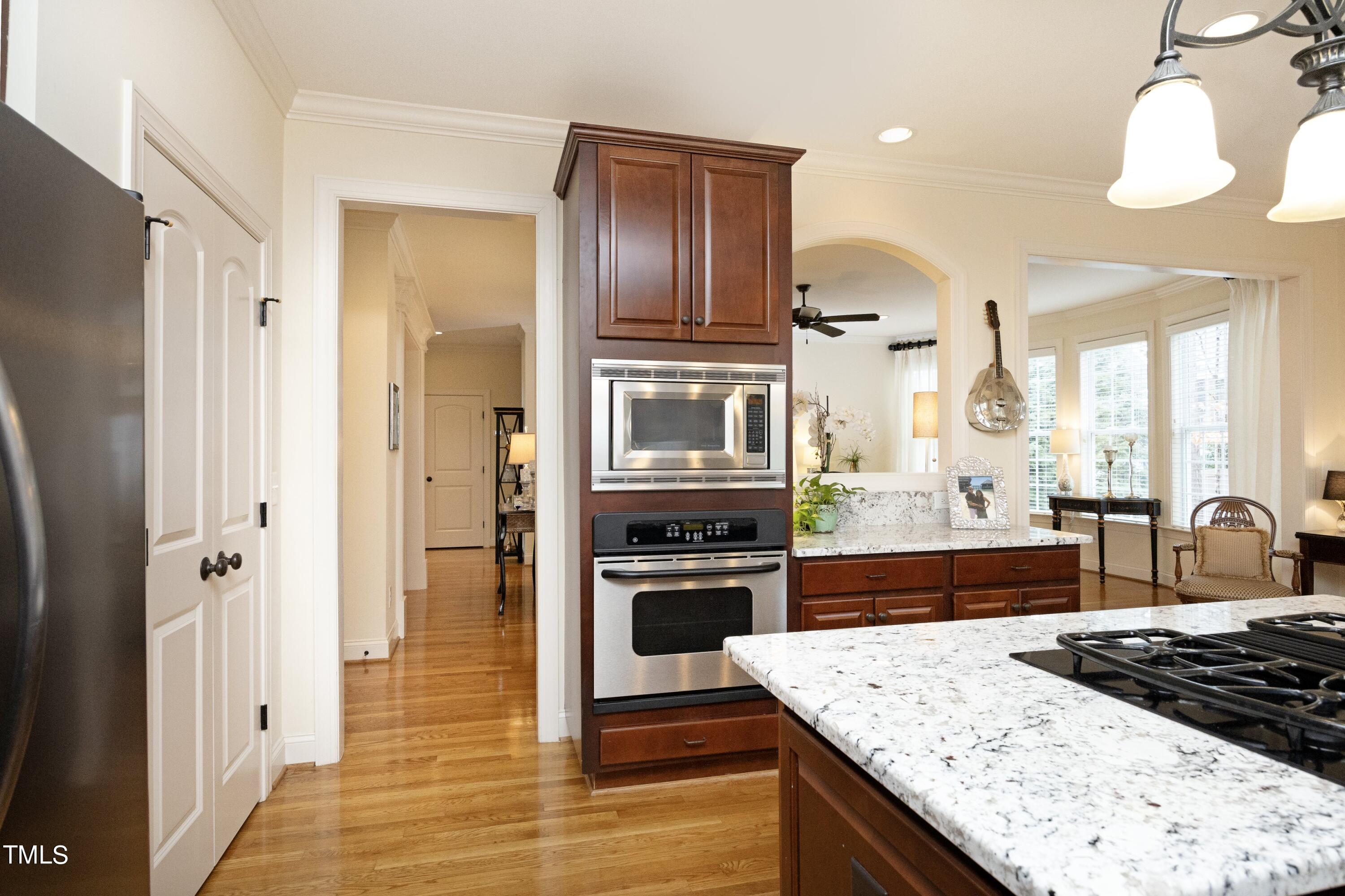 11514 Autumn Oaks Lane Raleigh, NC 27614 - Photo 16 of 39 a kitchen with stainless steel appliances granite countertop a refrigerator and a stove top oven