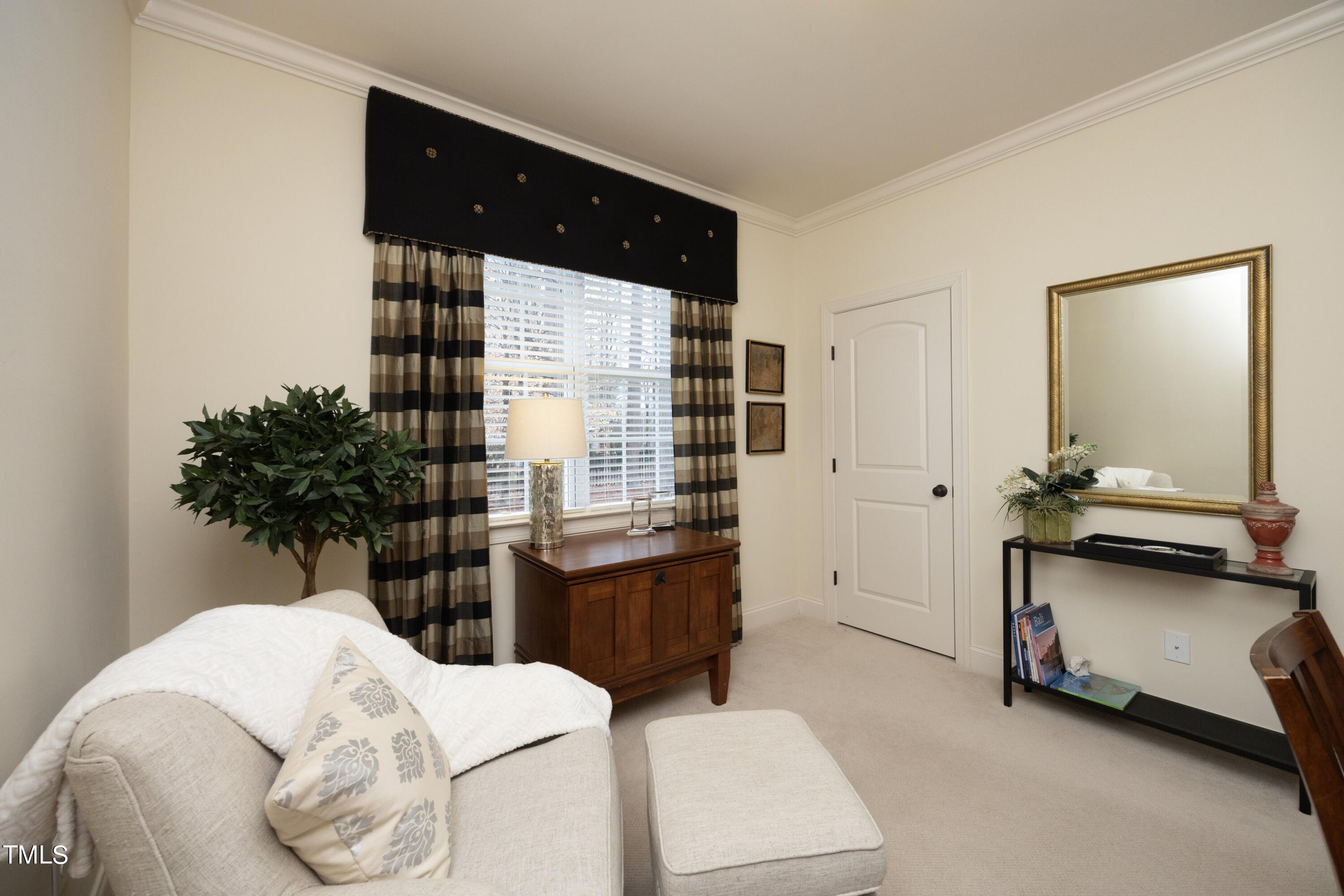 11514 Autumn Oaks Lane Raleigh, NC 27614 - Photo 18 of 39 a bedroom with a bed and a potted plant