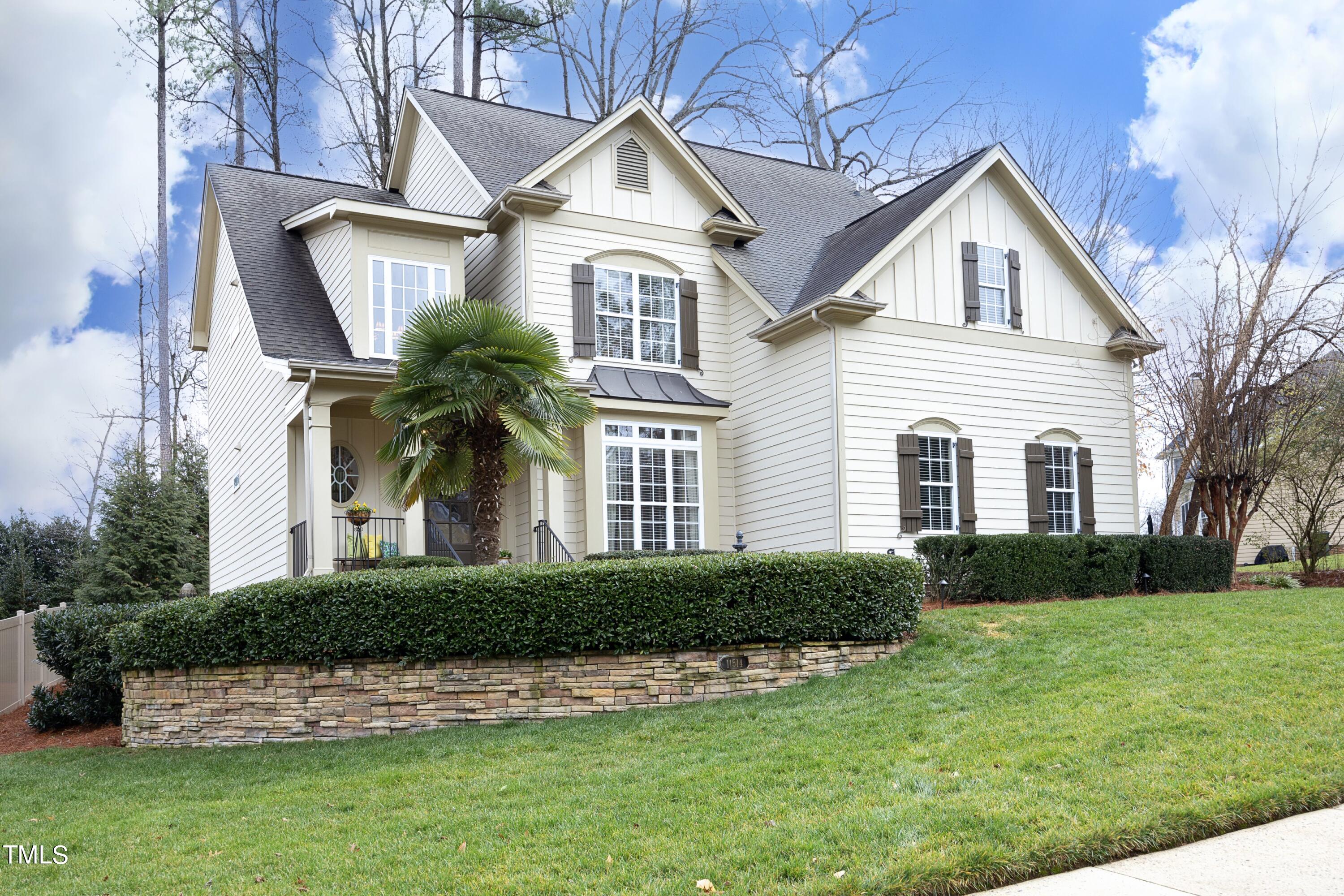 11514 Autumn Oaks Lane Raleigh, NC 27614 - Photo 2 of 39 a front view of a house with a yard and garage