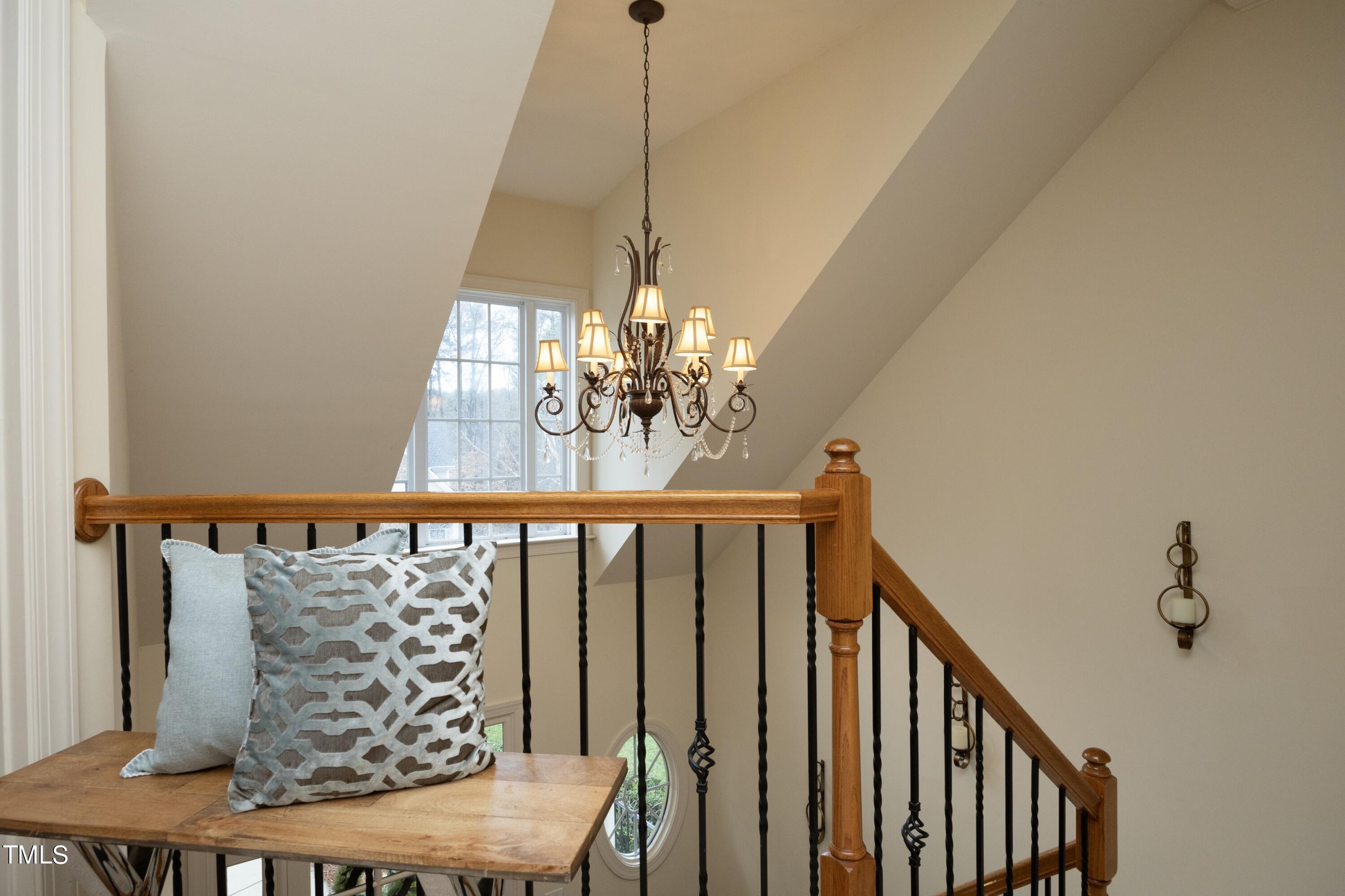 11514 Autumn Oaks Lane Raleigh, NC 27614 - Photo 21 of 39 a view of a balcony with furniture and chandelier