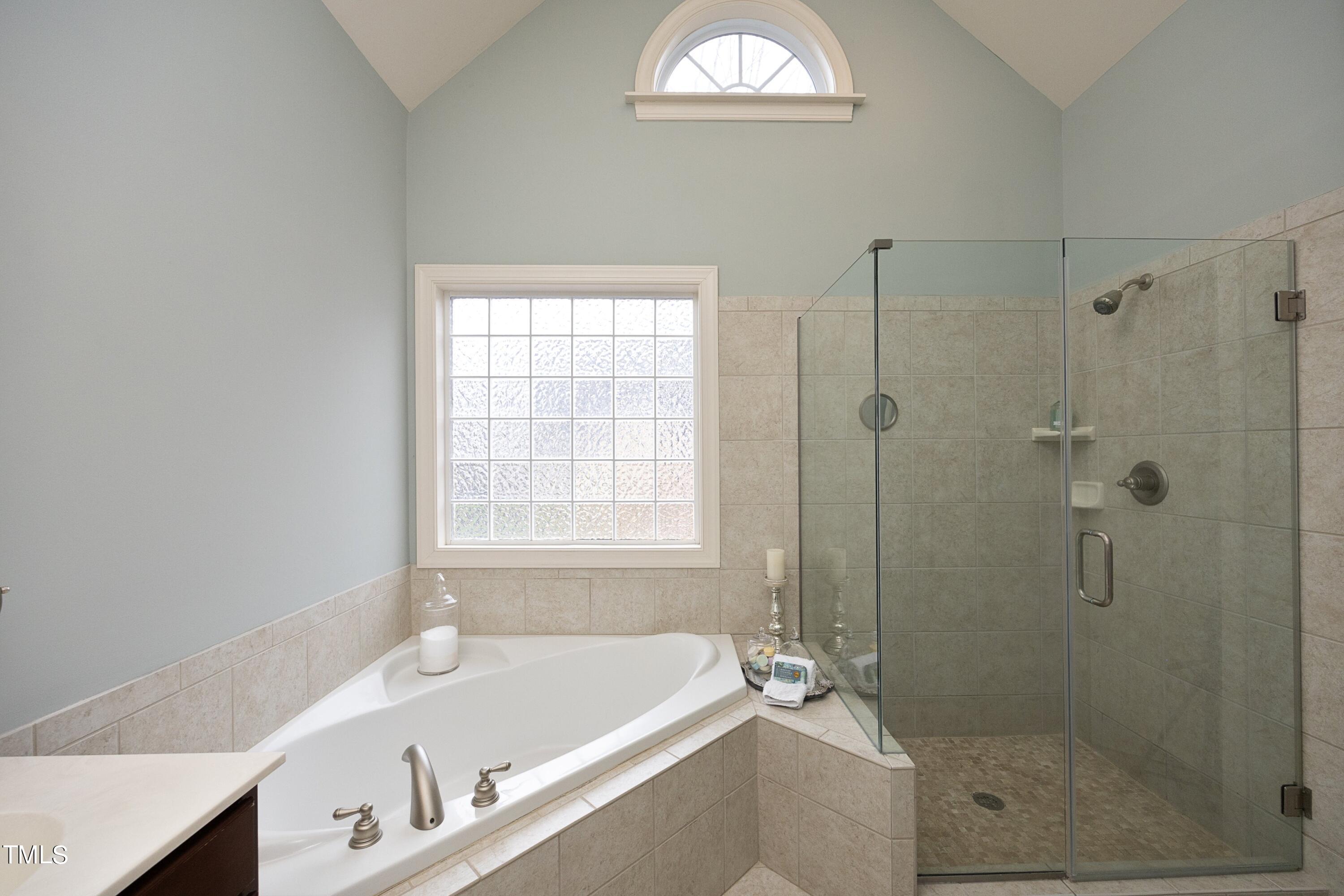 11514 Autumn Oaks Lane Raleigh, NC 27614 - Photo 26 of 39 a bath room with a bath tub and a shower