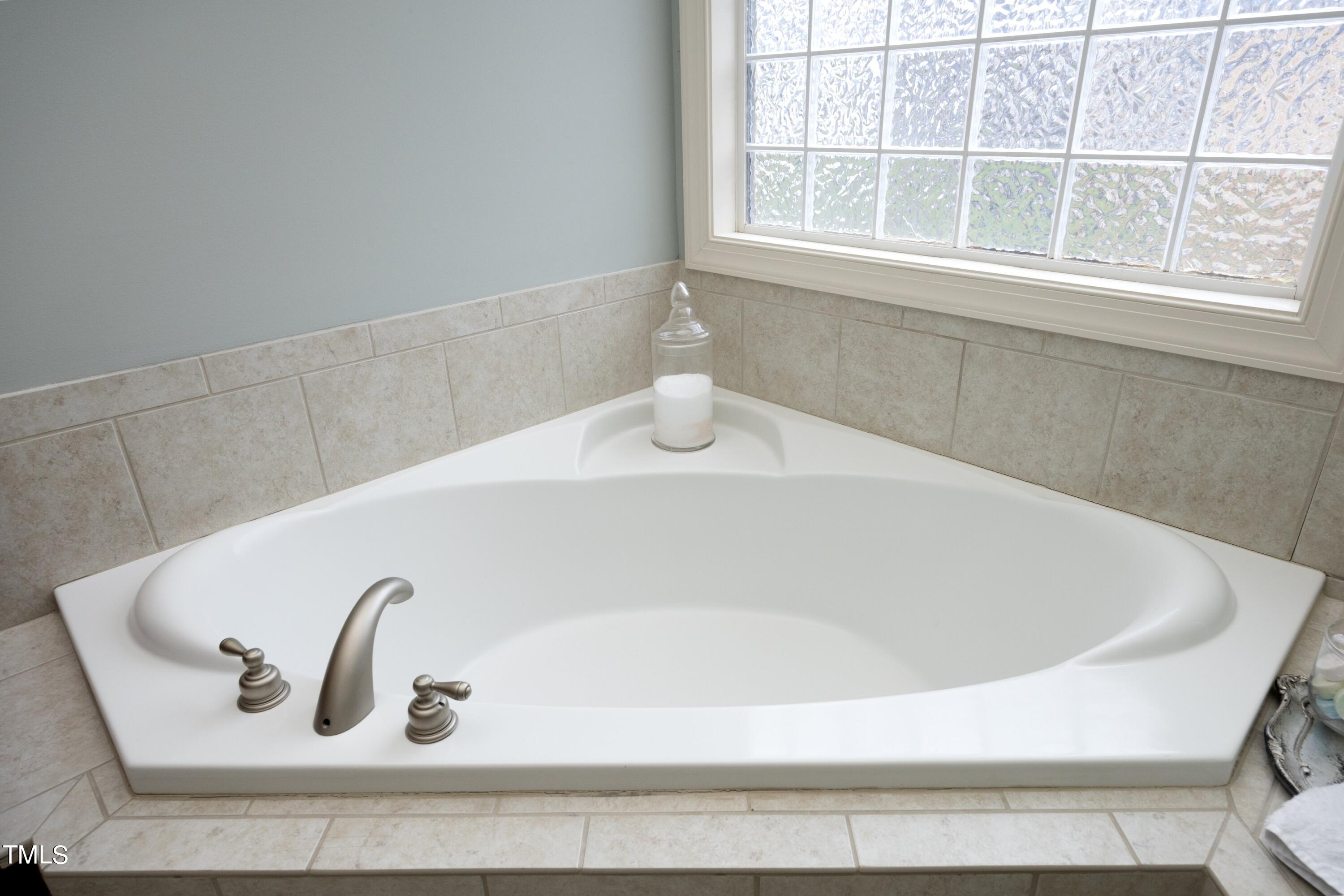 11514 Autumn Oaks Lane Raleigh, NC 27614 - Photo 27 of 39 a bathroom with a bathtub