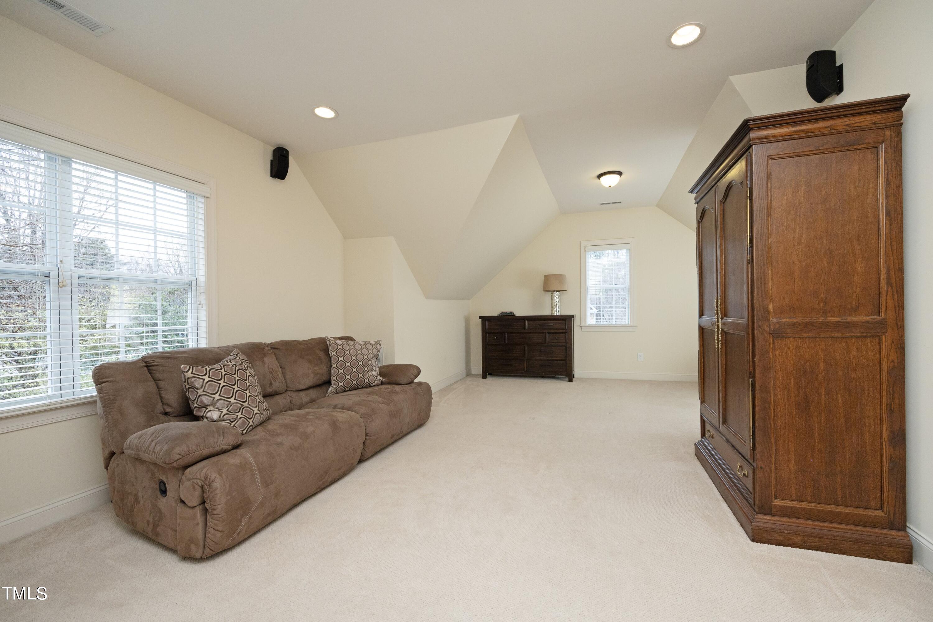 11514 Autumn Oaks Lane Raleigh, NC 27614 - Photo 28 of 39 a living room with furniture and a refrigerator
