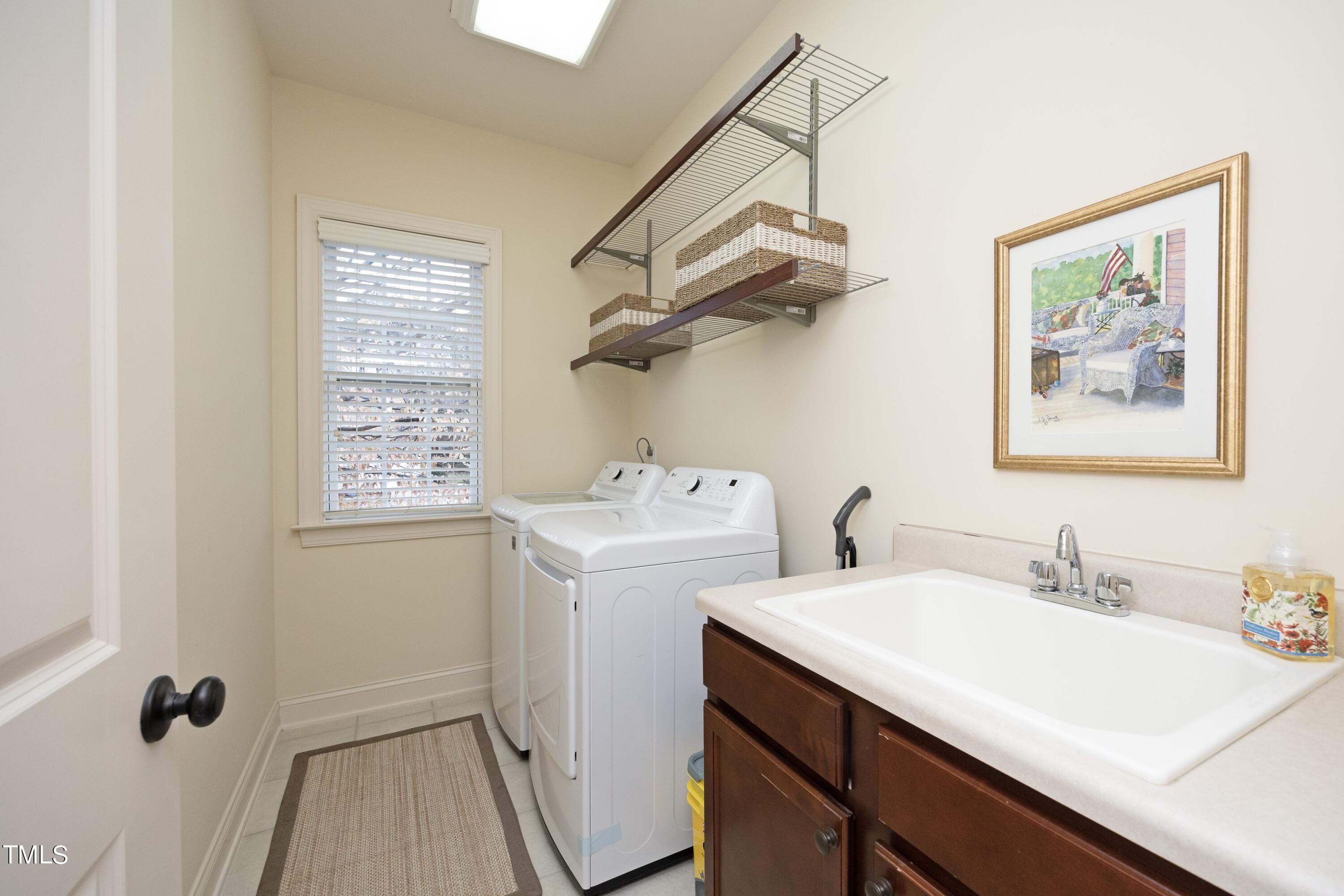 11514 Autumn Oaks Lane Raleigh, NC 27614 - Photo 34 of 39 a bathroom with a sink and a mirror