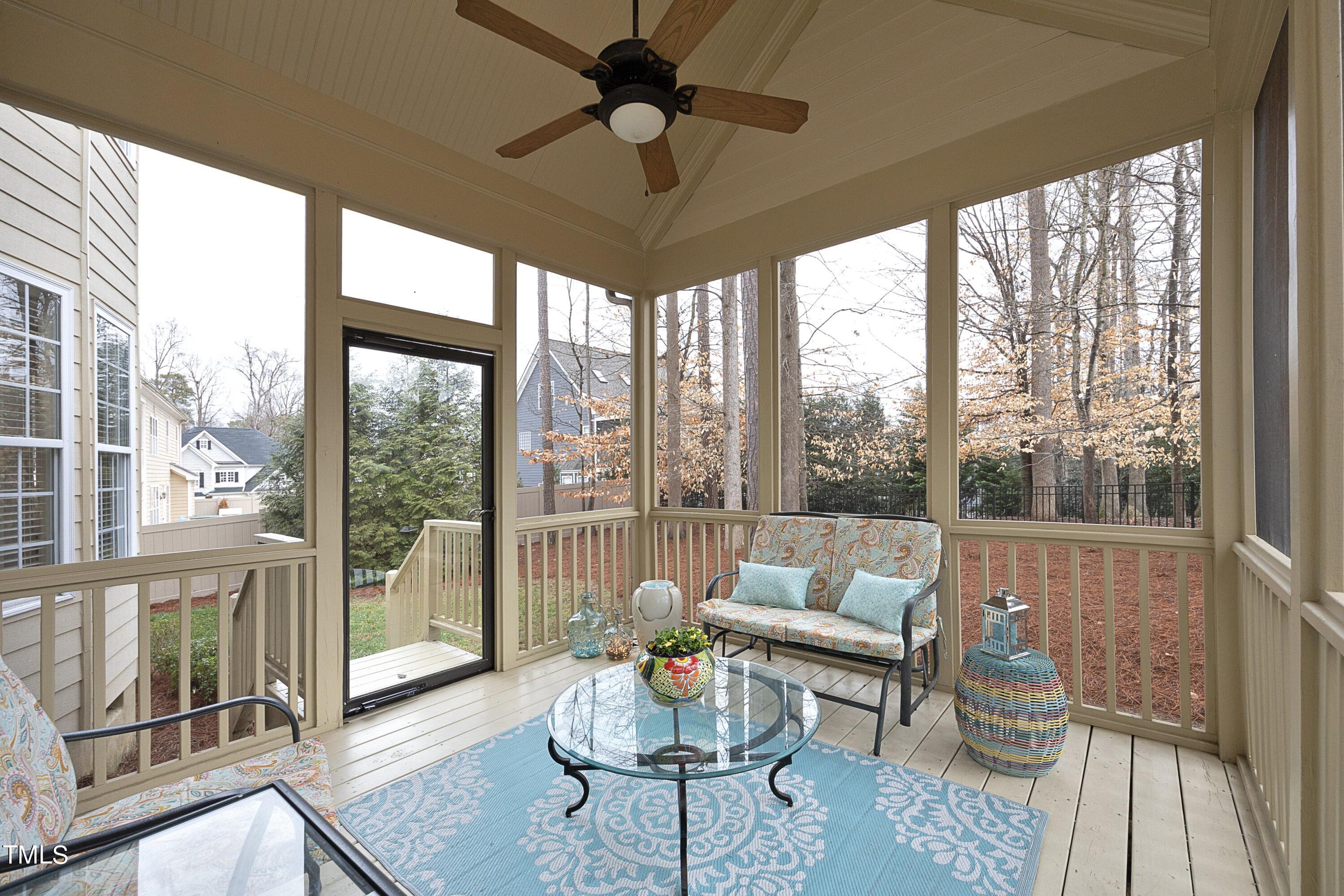 11514 Autumn Oaks Lane Raleigh, NC 27614 - Photo 35 of 39 a living room with furniture and a floor to ceiling window