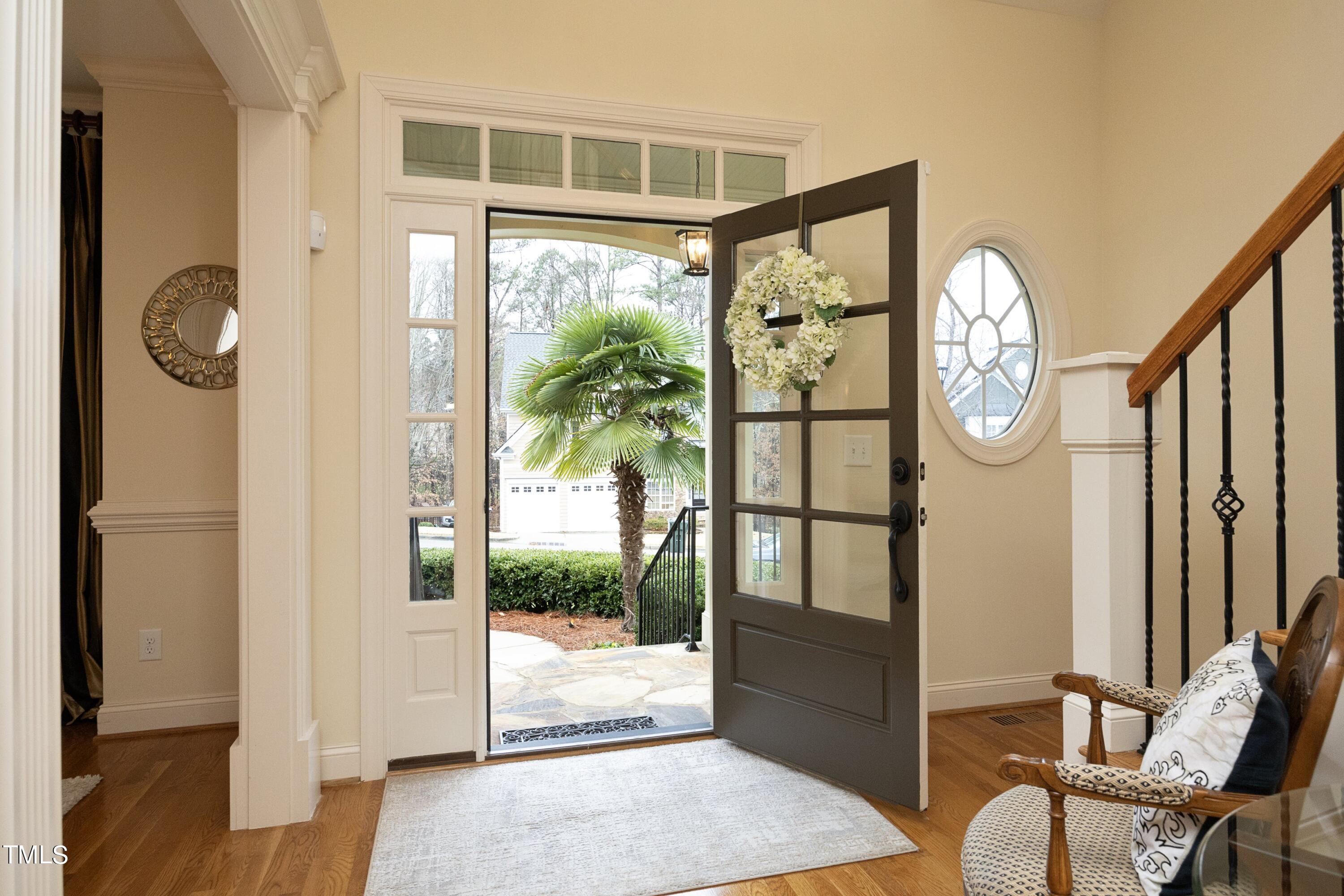 11514 Autumn Oaks Lane Raleigh, NC 27614 - Photo 6 of 39 a view of entryway with wooden floor and window