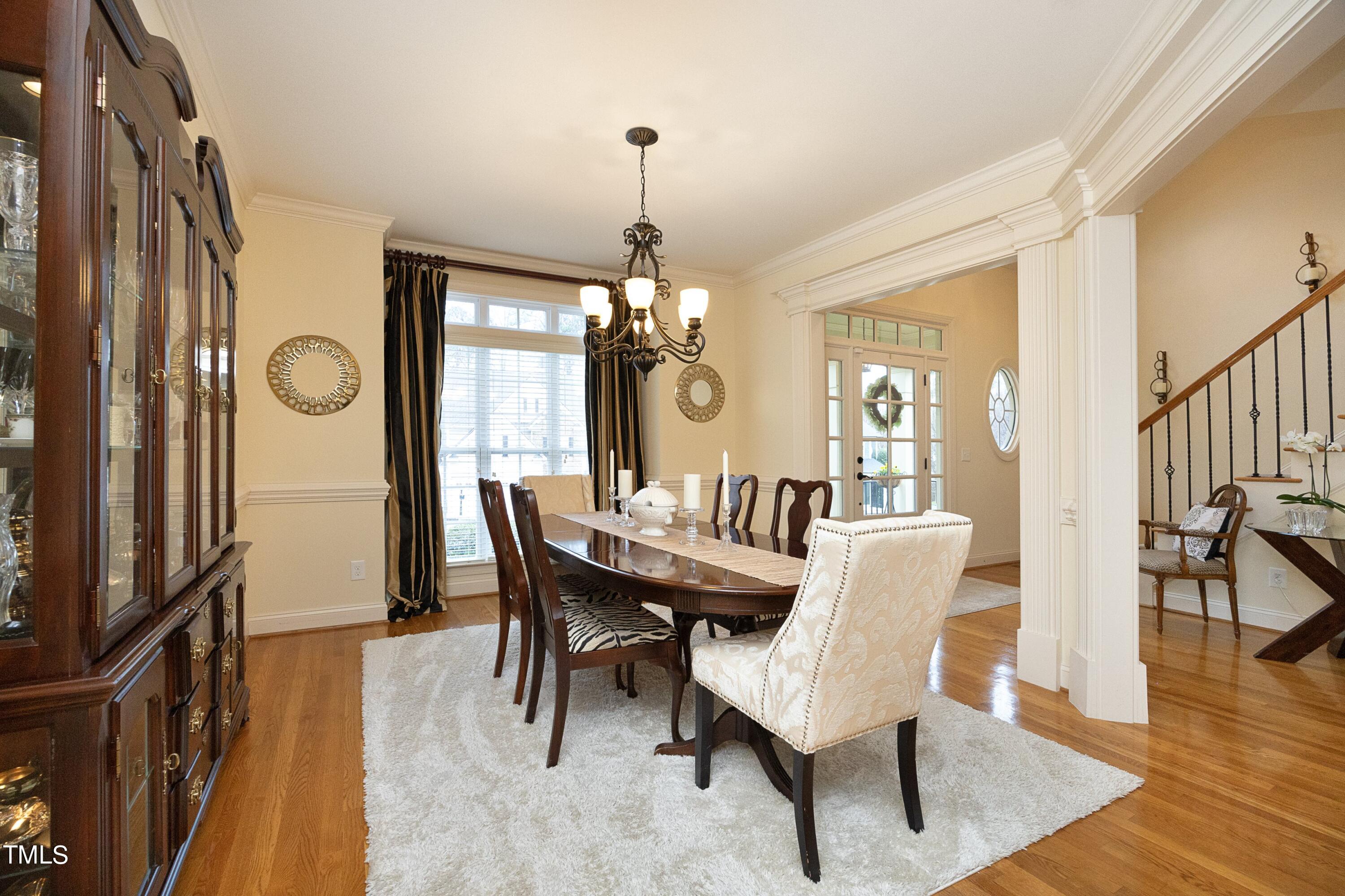 11514 Autumn Oaks Lane Raleigh, NC 27614 - Photo 10 of 39 a view of a dining room with furniture window and wooden floor