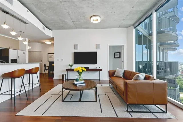 a living room with furniture and a flat screen tv