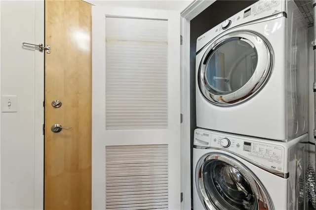 a view of a hallway with washer and dryer