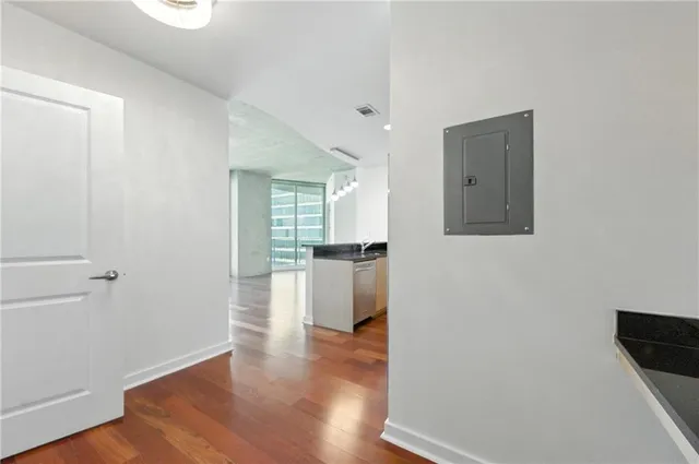 a view of a kitchen cabinets and wooden floor