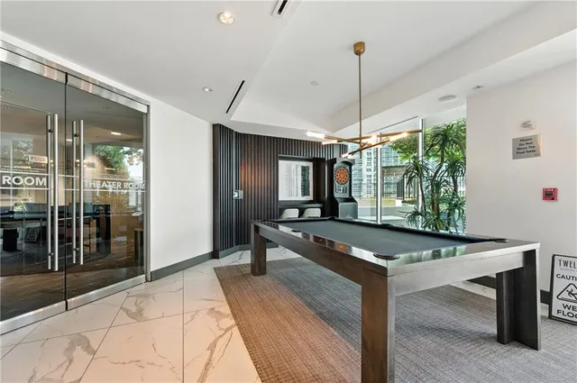a view of a patio with a dining table and chairs