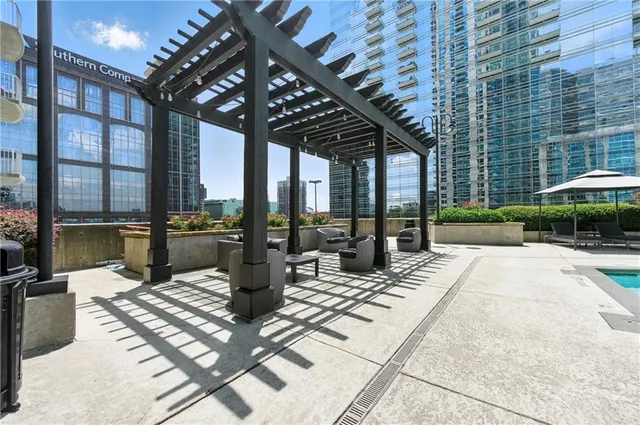 a view of a patio with couches and potted plants