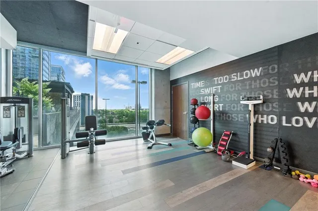 a gym room with lots of gym equipment