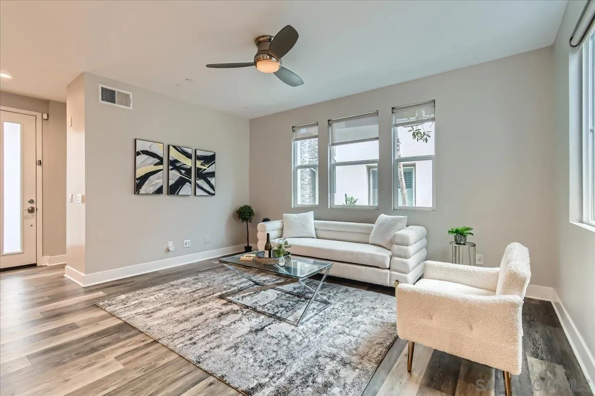 a living room with furniture and a window