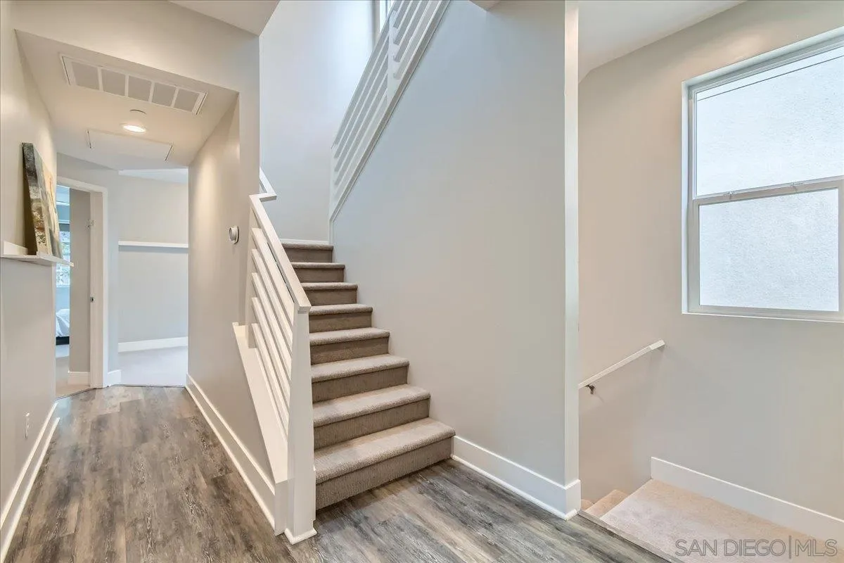 2290 Element Way Chula Vista, CA 91915 - Photo 11 of 34 a view of a hallway with wooden floor and entryway
