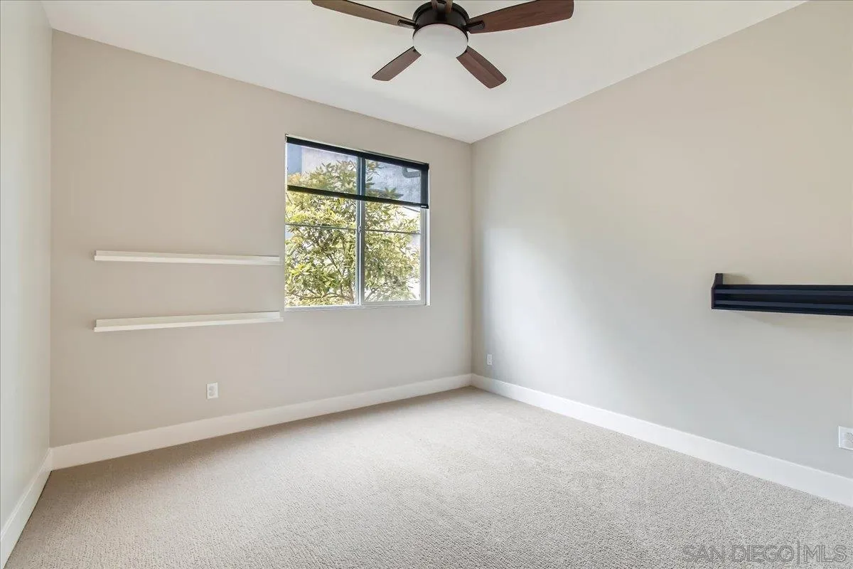 2290 Element Way Chula Vista, CA 91915 - Photo 16 of 34 an empty room with a window and a ceiling fan