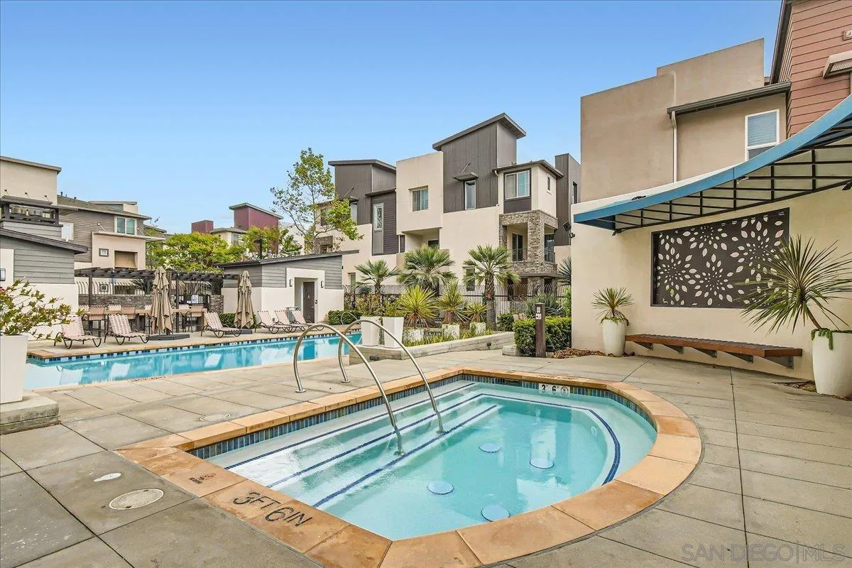 2290 Element Way Chula Vista, CA 91915 - Photo 31 of 34 a view of a swimming pool with a lounge chairs