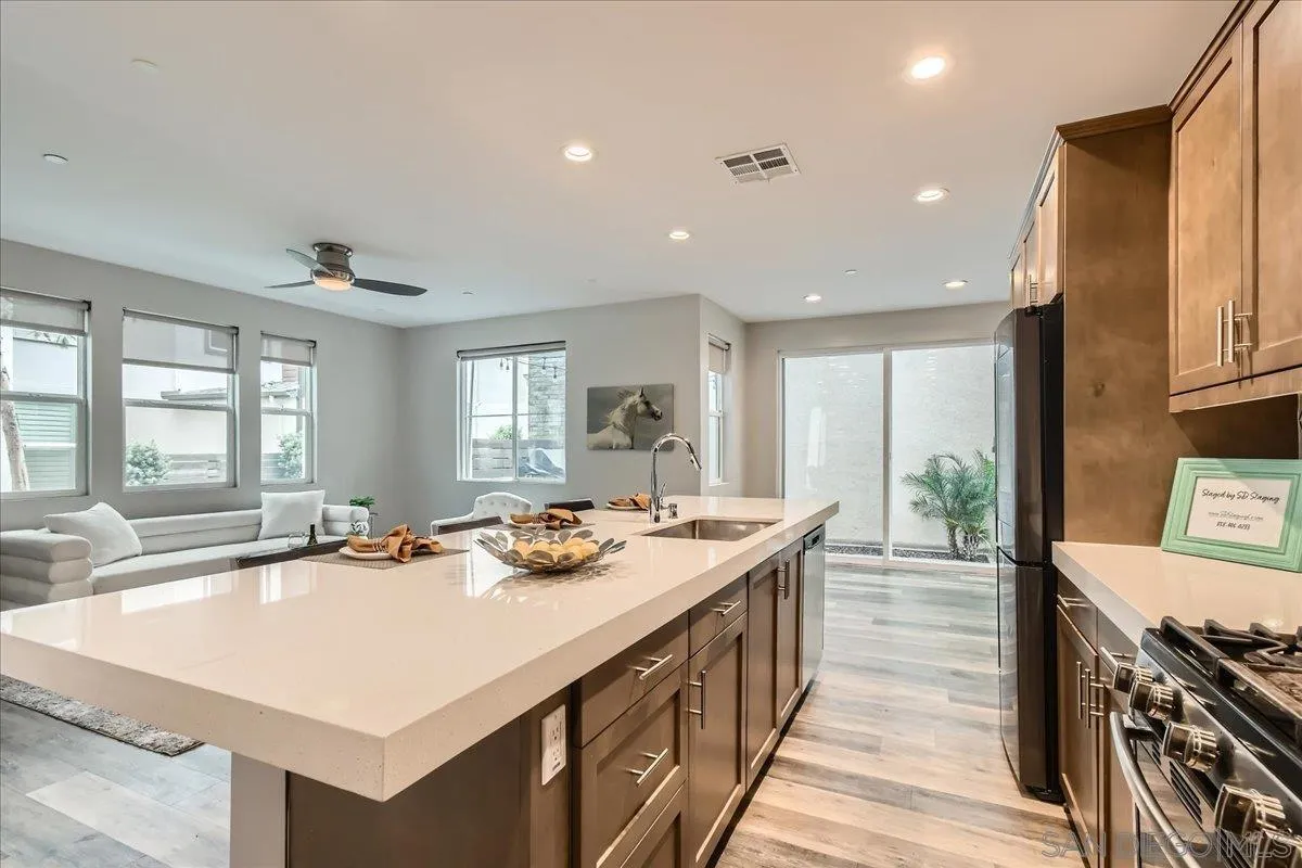 2290 Element Way Chula Vista, CA 91915 - Photo 5 of 34 a dining hall with stainless steel appliances granite countertop a stove and a sink