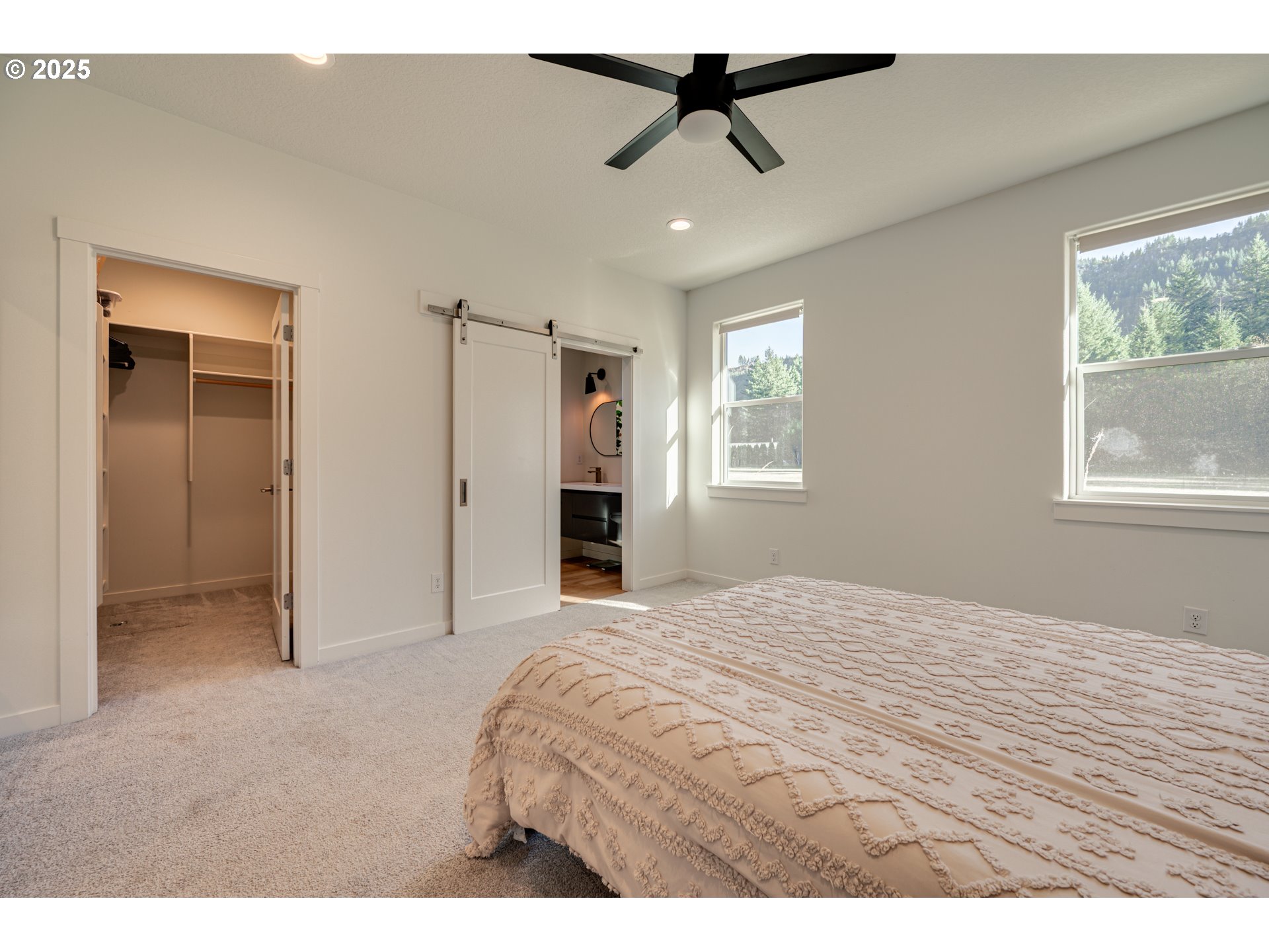 192 Stuart Field Lane Ariel, WA 98603 - Photo 16 of 35 a bedroom with a bed and a window