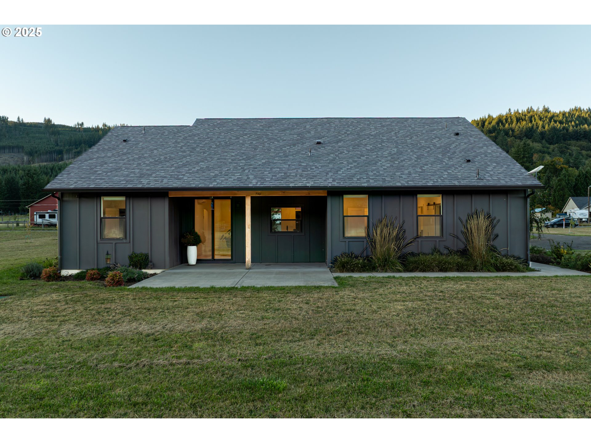 192 Stuart Field Lane Ariel, WA 98603 - Photo 30 of 35 a front view of a house with a garden